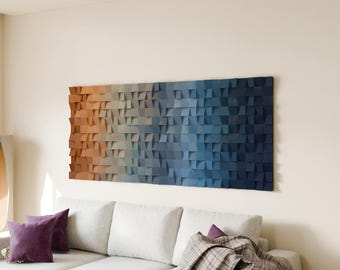 May include: A rectangular wall art piece composed of numerous small, square wooden blocks arranged in a grid. The blocks feature a color gradient transitioning from warm orange on the left to deep navy blue on the right side.