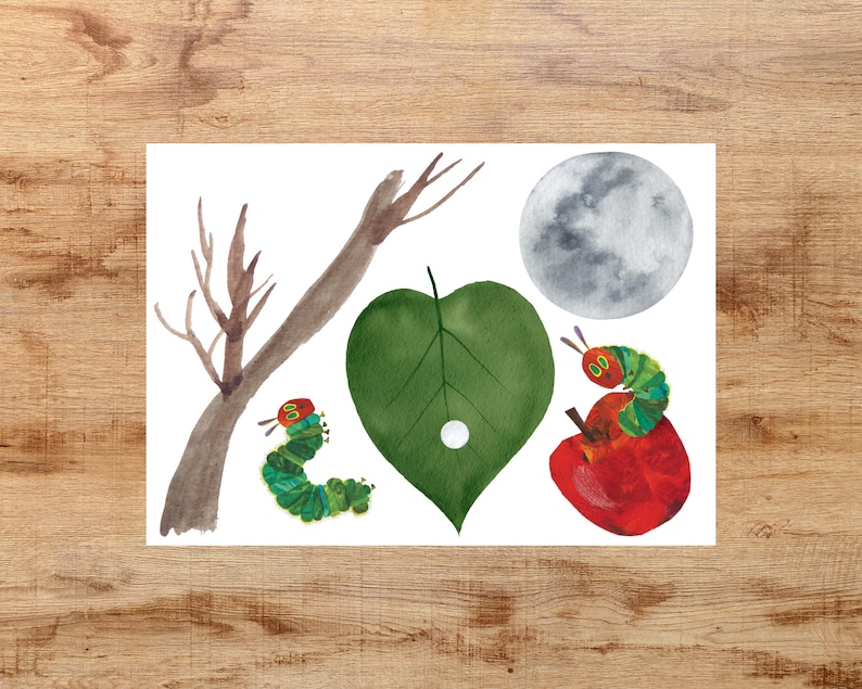 May include: A watercolor illustration of a green leaf with a white circle in the center, a gray moon, a brown branch, and two green caterpillars with red heads. One caterpillar is eating a red apple.