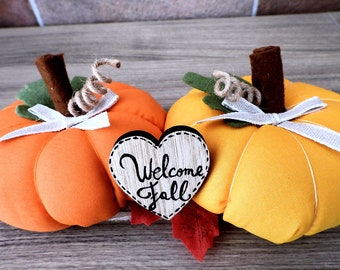 Decorative autumn centerpiece with cotton and felt pumpkins on a wooden base, completely handmade