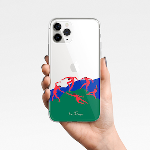 May include: Clear phone case with a colorful design. The case features a green and blue landscape with red figures dancing. The text "Le Dingo" is printed at the bottom of the case.