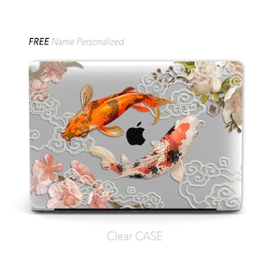 May include: A clear laptop case with a design featuring two koi fish swimming in a cloud pattern with pink cherry blossoms. The text "FREE Name Personalized" is at the top of the case.