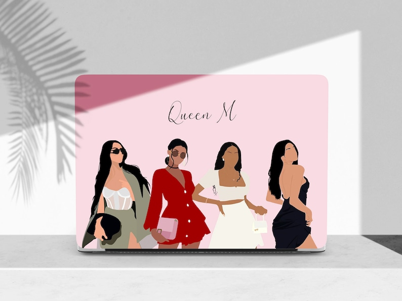 May include: Laptop skin with a pink background and the text "Queen M" at the top. Four women are depicted in the image, each wearing a different outfit. The women are all facing forward and have long, dark hair.
