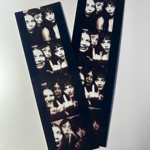 May include: Two black and white photo strips featuring multiple images of women. The images show the women making various facial expressions, including smiles and gestures. The strips are on a white surface.