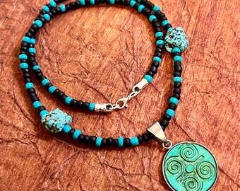 Cherokee symbol for strength glass seed and hematite turquoise beaded wood engraved metal bezel necklace..