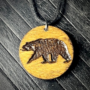 Black bear totem engraved wood charm cord necklace..