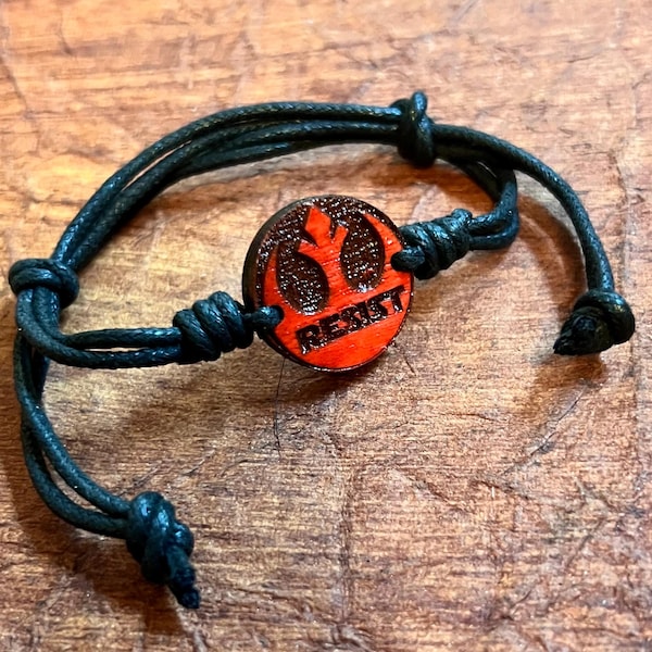 The rebellion RESIST symbol all wood pendant engraved adjustable cord bracelet