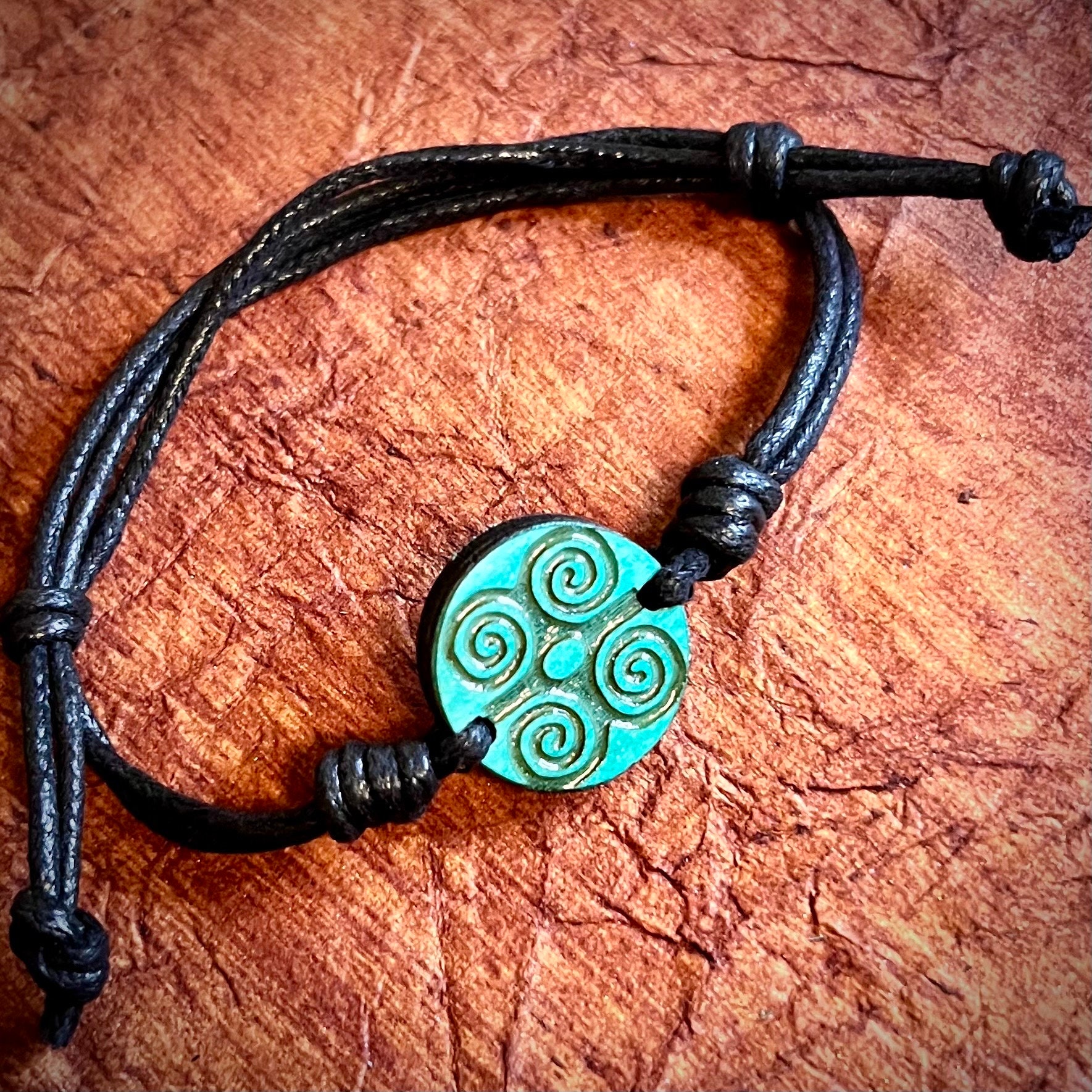 Cherokee symbol for strength all wood engraved 1 inch pendant adjustable cord bracelet