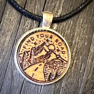 Find your road engraved wood charm cord necklace..