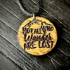Not all who wander are lost engraved wood charm cord necklace..