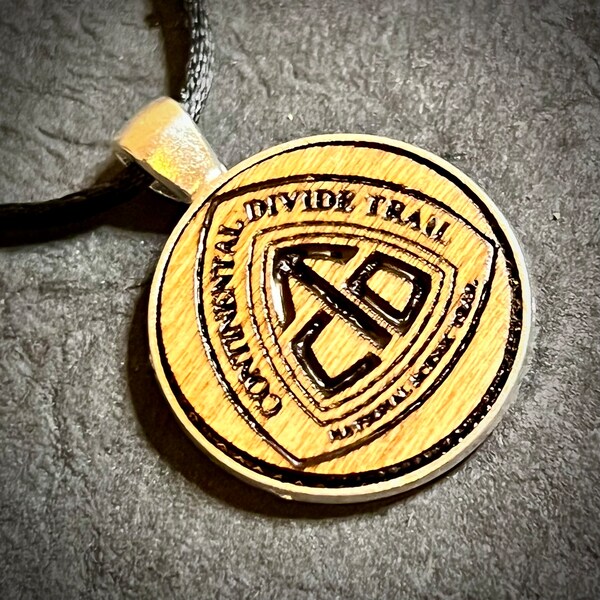 Continental divide trail wood engraved metal bezel pendant adjustable satin cord necklace