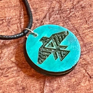 Native Thunderbird wood engraved charm cord necklace