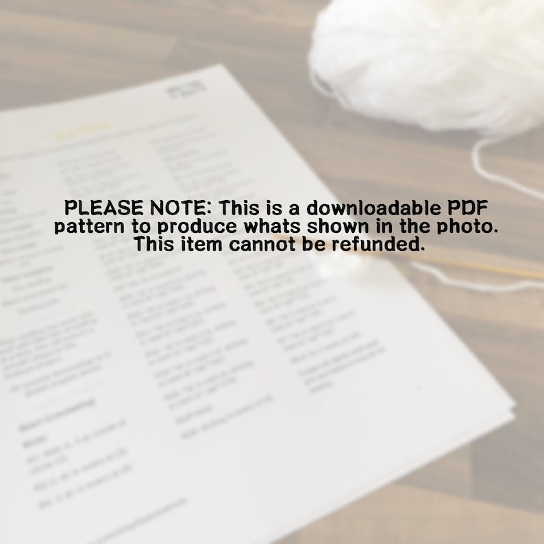 May include: A black and white printable PDF pattern for crocheting a white crocheted blanket. The text on the page reads "PLEASE NOTE: This is a downloadable PDF pattern to produce whats shown in the photo. This item cannot be refunded."