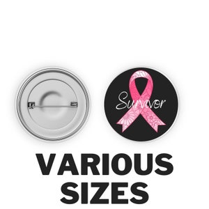 May include: Two round pinback buttons. One shows the back with a safety pin clasp. The other has a pink ribbon with floral details and the word "Survivor" on a black background. The text "VARIOUS SIZES" is below.
