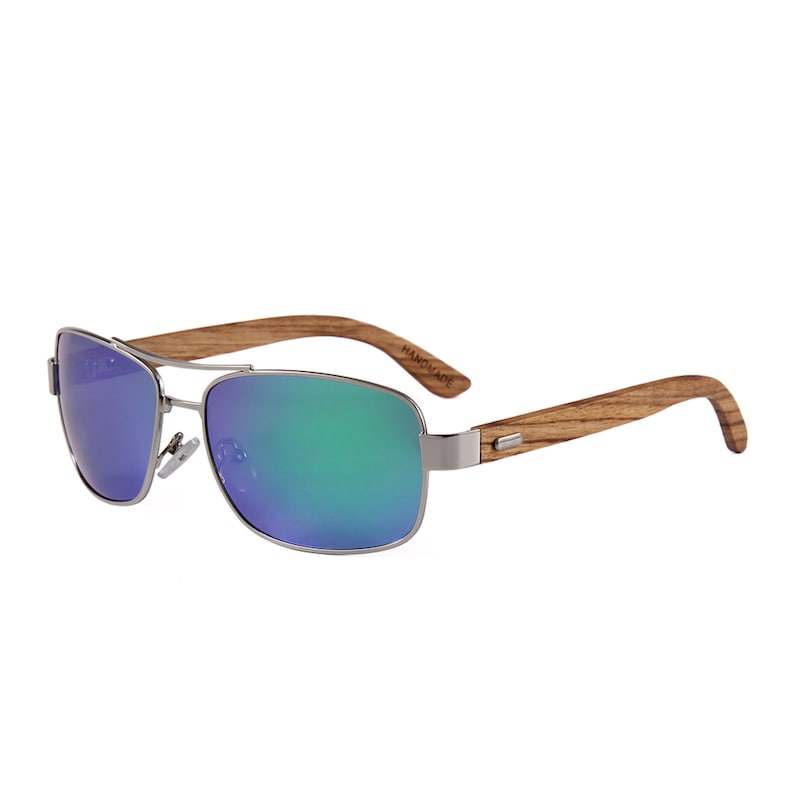 May include: Silver aviator sunglasses with green and blue mirrored lenses and a wooden frame. The frame is labeled "HANDMADE".