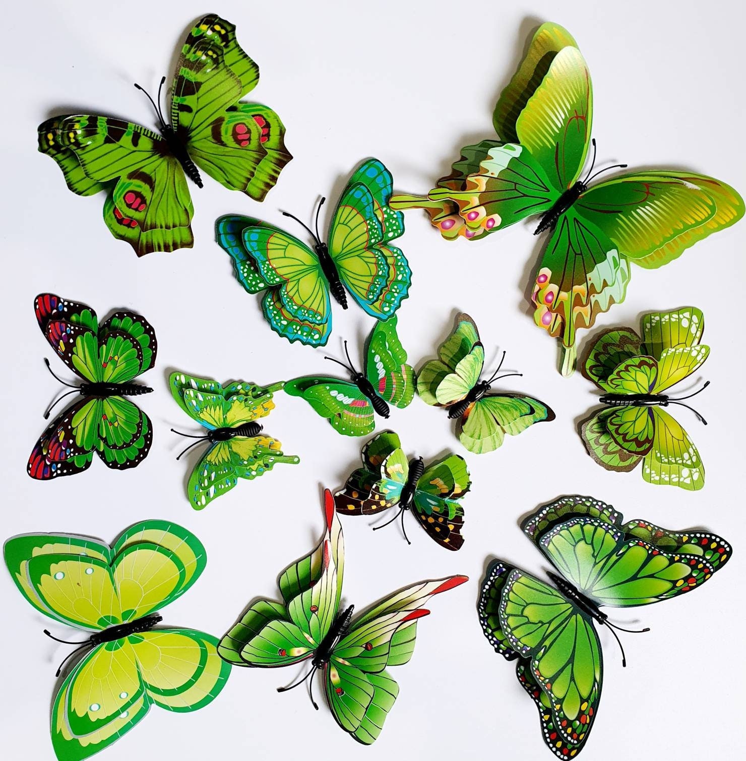 Juego de 12 mariposas de plumas monarca con purpurina en alambre para  arreglos florales y decoraciones de bricolaje (negro, blanco/plateado)