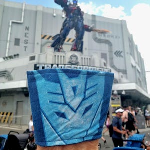 Pochette réversible sur le thème Transformers pour café chaud ou froid/thé douillet/veste en java/koozie café glacé