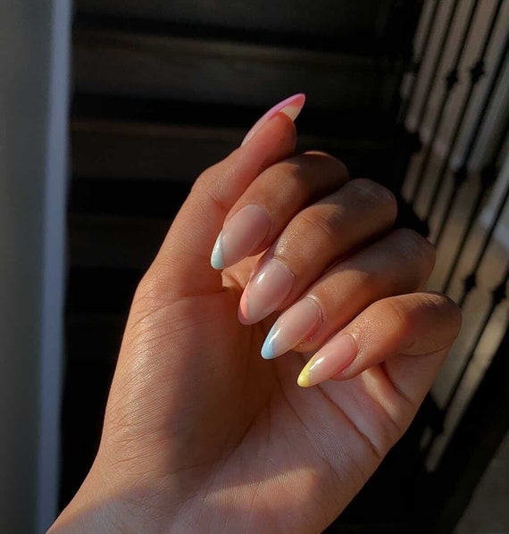 Premium Photo | Close up of a woman hand with perfect natural neutral  delicate manicure long nails in pastel color