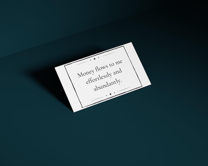A money mantra card is shown against a deep teal background.
