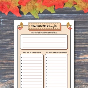 Thanksgiving thoughts gratefulness activity is shown on a wood background lined with colorful fall leaves.