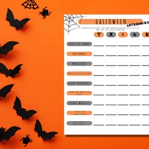 Halloween Categories printable word game is shown on a bright orange background with black bats. This fun printable party game is designed in gray, black, and orange, with Halloween-related categories like costumes and scary movies.