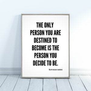 A minimalistic inspirational quote art print leans against a wall - The only person you are destined to become is the person you decide to be. Ralph Waldo Emerson.