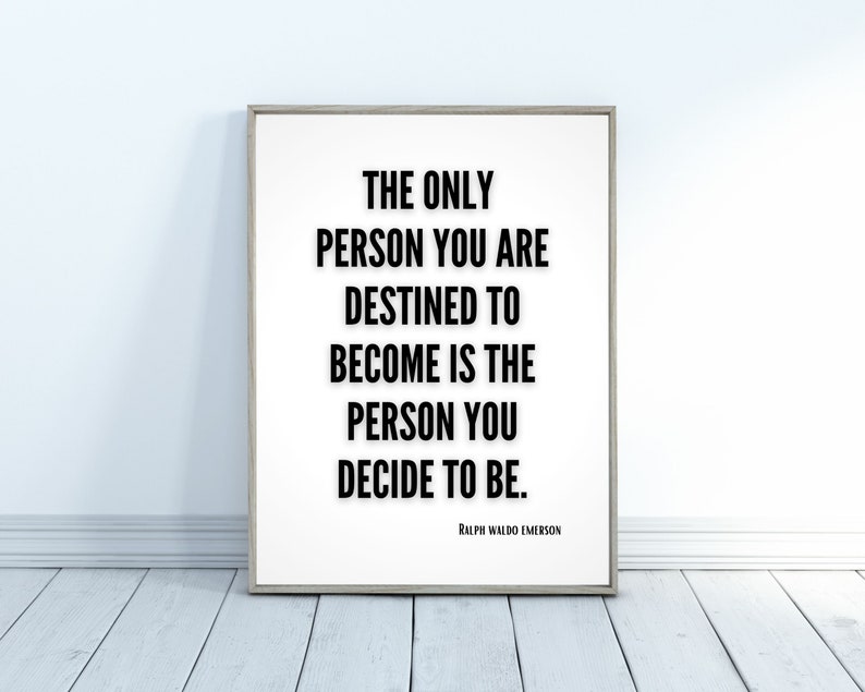 A minimalistic inspirational quote art print leans against a wall - The only person you are destined to become is the person you decide to be. Ralph Waldo Emerson.