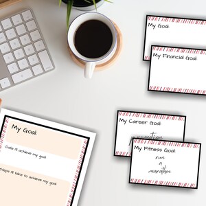 May include: A set of printable goal setting cards with red and white stripes. The cards have the text "My Goal", "My Financial Goal", "My Career Goal", and "My Fitness Goal".
