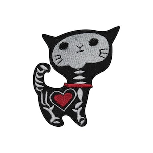 May include: Embroidered patch featuring a black cat skeleton design with a red heart and collar. The cat's head and body are black, with white embroidered details depicting the skeleton. The patch is designed to be ironed or sewn onto fabric.
