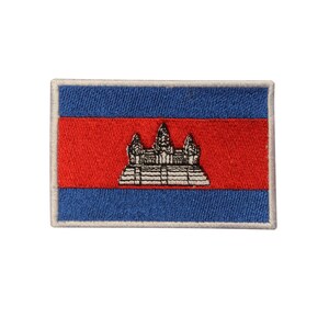 May include: Embroidered patch of the Cambodian flag. The flag is red, blue, and white with a depiction of Angkor Wat in the center.