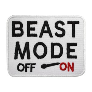 May include: White embroidered patch with black text that reads "BEAST MODE OFF ON" with a black toggle switch and the word "ON" in red.