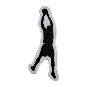 May include: Black silhouette of a basketball player shooting a hoop. The player is outlined in white.