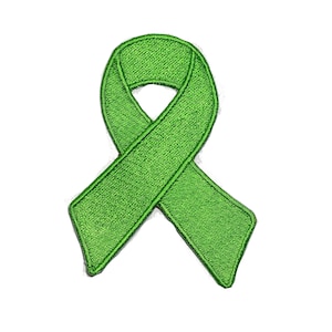 Peut inclure: Un ruban vert, symbole de soutien et de sensibilisation à diverses causes.
