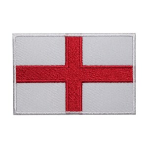 May include: A white embroidered patch with a red cross, representing the flag of England.