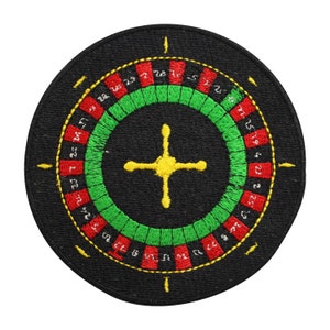 May include: A black felt circular patch with a red and green roulette wheel design. The wheel has numbers 1 through 36, and a zero. The center of the wheel has a yellow cross.