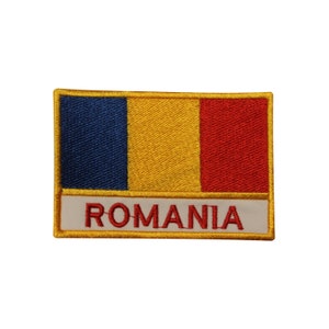 May include: An embroidered patch featuring the Romanian flag with the word "ROMANIA" written below. The flag is blue, yellow, and red.