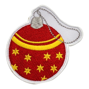 May include: Red Christmas bauble with a yellow band and gold stars. The bauble has a white loop for hanging.