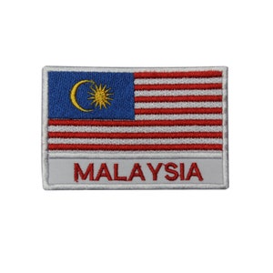 May include: A white embroidered patch with the Malaysian flag and the word "MALAYSIA" in red lettering.