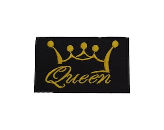 May include: A black embroidered patch with a gold crown and the word "Queen" in a cursive font.
