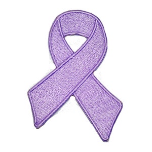 May include: A lavender awareness ribbon patch. The embroidered ribbon is a loop with two downward-pointing tails. The patch is a solid lavender color and is set against a white background.