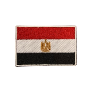 May include: Embroidered patch depicting the Egyptian flag. The rectangular patch features horizontal stripes of red, white, and black. A gold emblem is centered on the white stripe. The patch is bordered with a white stitch.