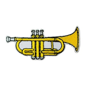 May include: A yellow trumpet with black detailing. The trumpet is embroidered on a white background.