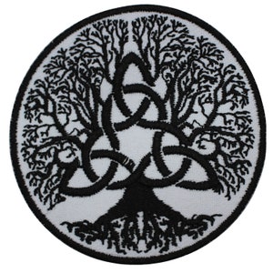 May include: Circular patch with a black tree of life design on a white background. The tree features detailed branches and roots, with a Celtic knot at the centre. The patch is edged with a black border.