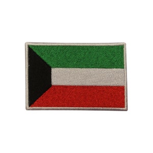 May include: An embroidered patch featuring the flag of Kuwait. The flag is green, white, and red with a black triangle in the upper left corner.
