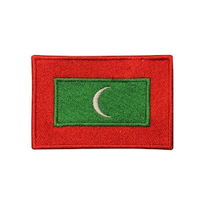 May include: A red and green embroidered patch with the flag of the Maldives. The flag features a white crescent moon on a green rectangle, centered on a red background.