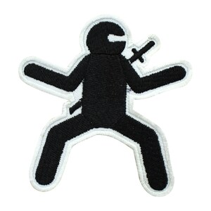 May include: Black embroidered patch of a ninja figure with a sword, outlined in white.