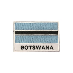 May include: An embroidered patch featuring the flag of Botswana. The patch is white with a blue background and a black horizontal stripe. The word "BOTSWANA" is written in black below the flag.