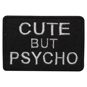 May include: Black embroidered patch with white text that reads "Cute But Psycho".