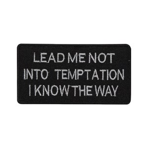 May include: Black embroidered patch with white text that reads "Lead me not into temptation I know the way".