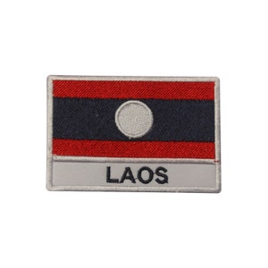 May include: A white embroidered patch with the flag of Laos and the word "LAOS" written below it.