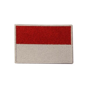May include: A red and white embroidered patch with the flag of Indonesia.